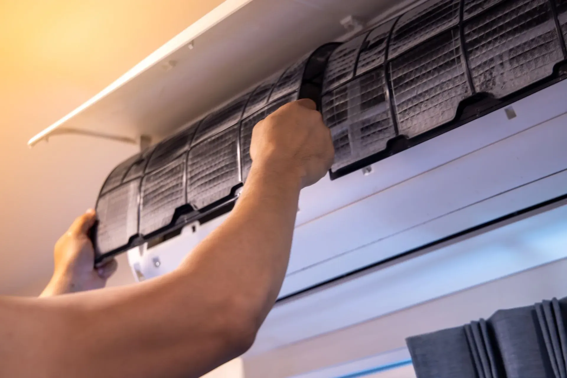 HVAC technician inspecting an AC not working in Gretna, NE.