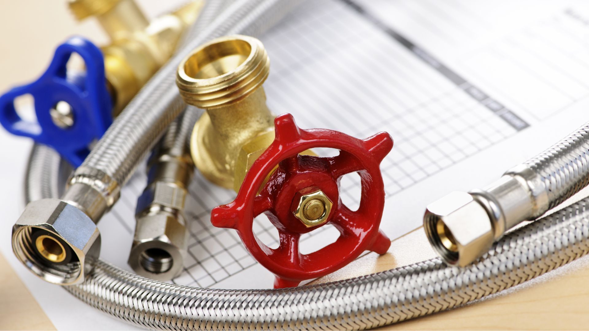 A hose with a red valve on top of it