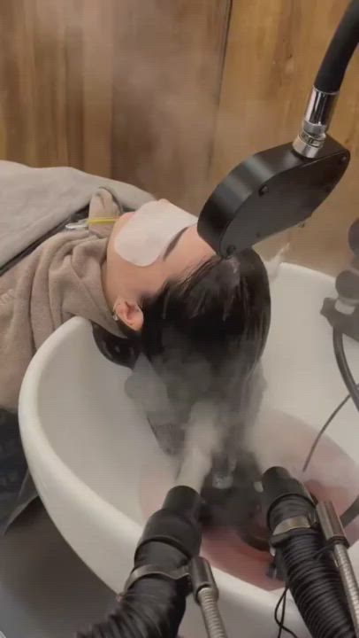 Guest receiving a relaxing hair wash and massage at JUNO HAIR Myeongdong Branch 4