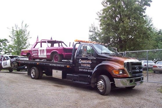 Tow Truck with Pink Car on the Back – Canton, OH – Mike Spencer Towing 