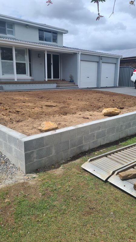 A large house with a lot of dirt in front of it.
