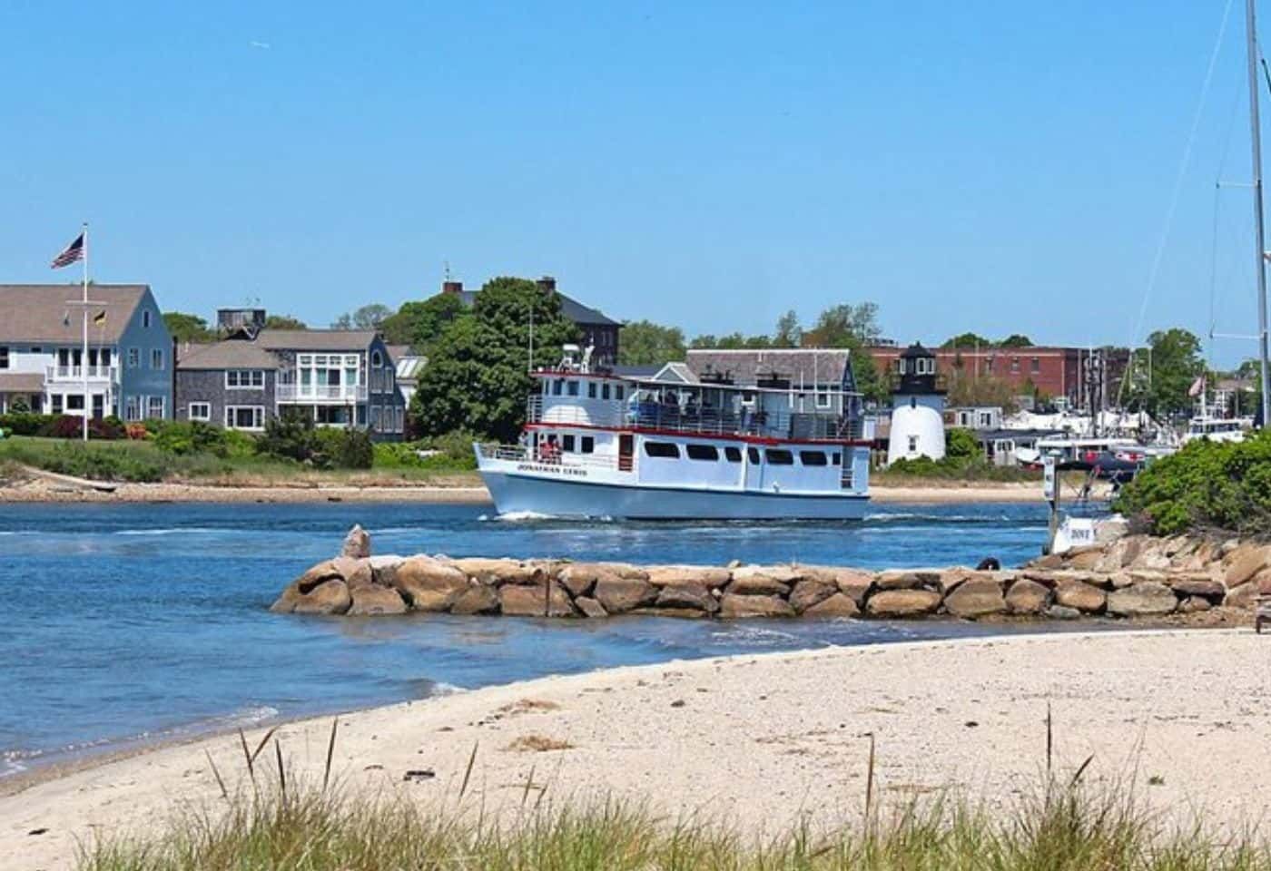 Cape Cod shoreline with a passenger boat and seaside homes