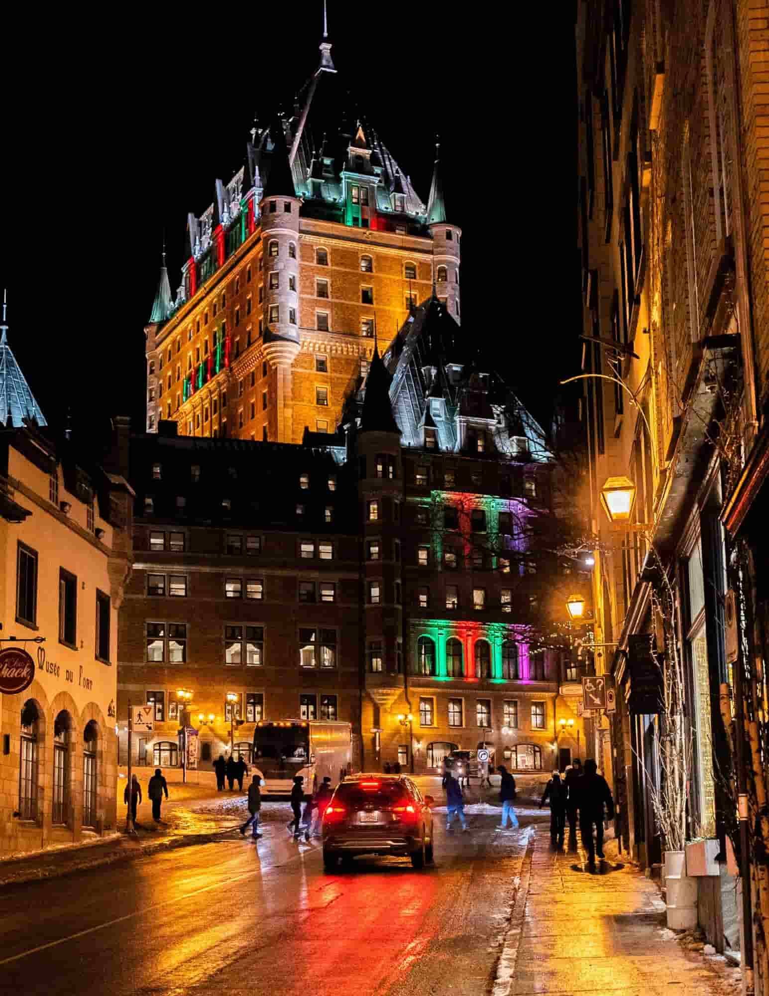 Festive wooden stalls at the Old Quebec German Christmas Market glowing with lights, surrounded by 