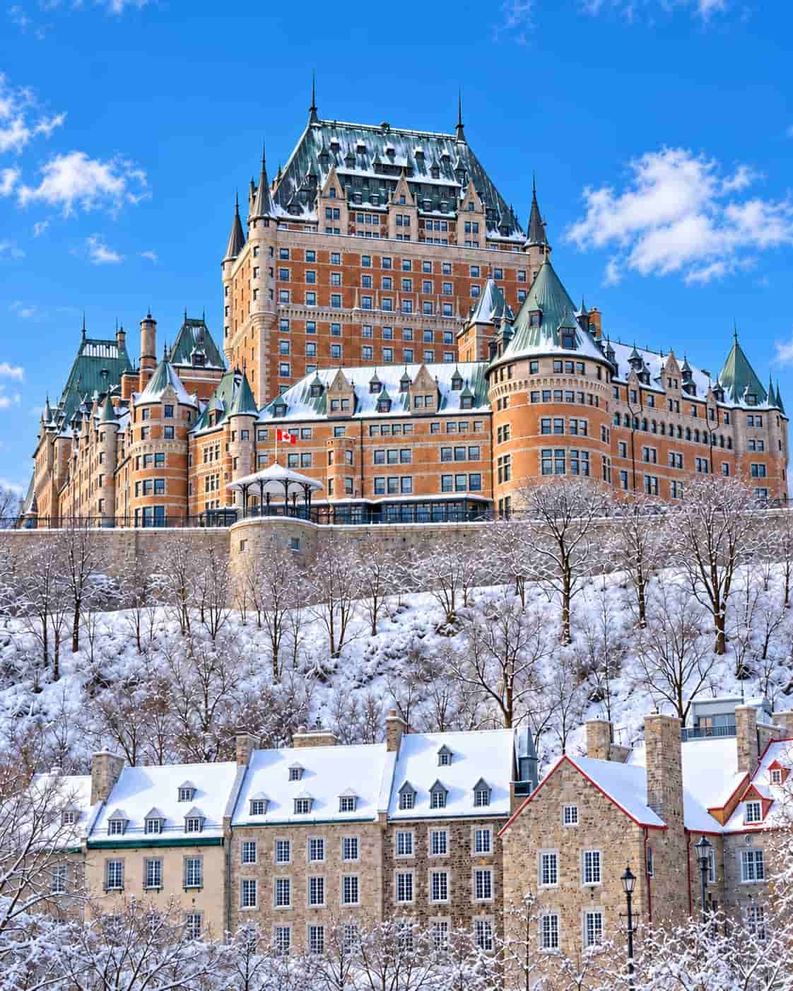 Fairmont Le Château Frontenac overlooking snow-covered Old Québec under a bright blue winter sky