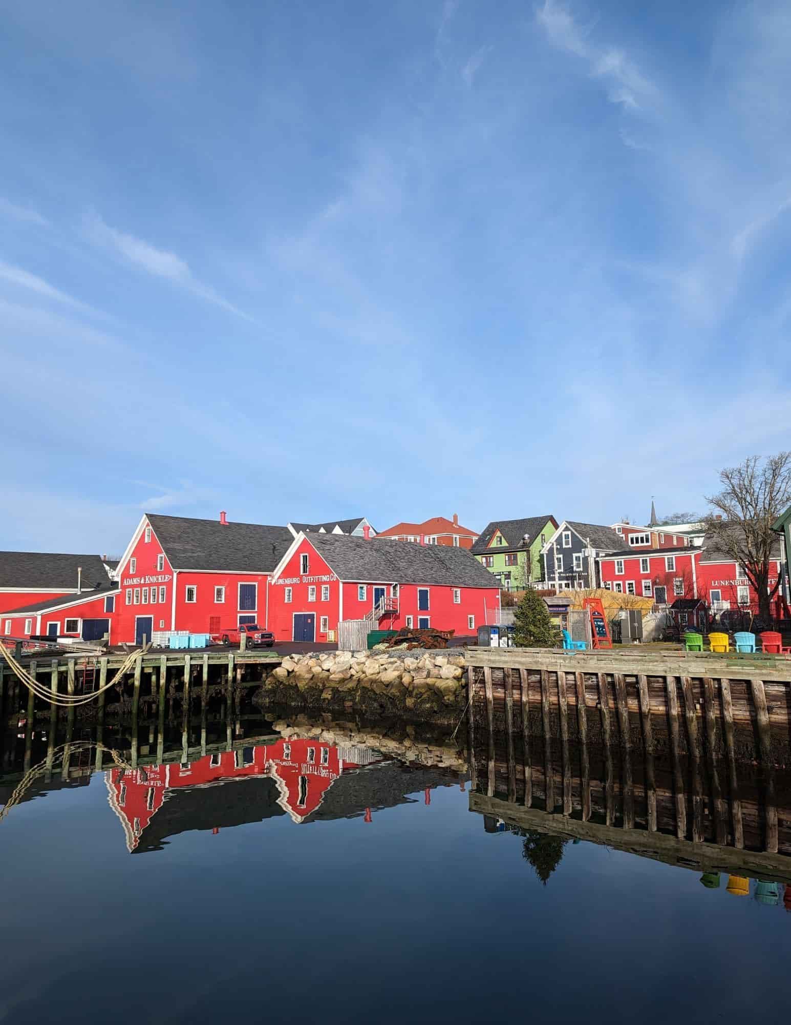 Colourful waterfront buildings reflected in the harbour at Lunenburg, a UNESCO World Heritage Site in Nova Scotia, Canada.