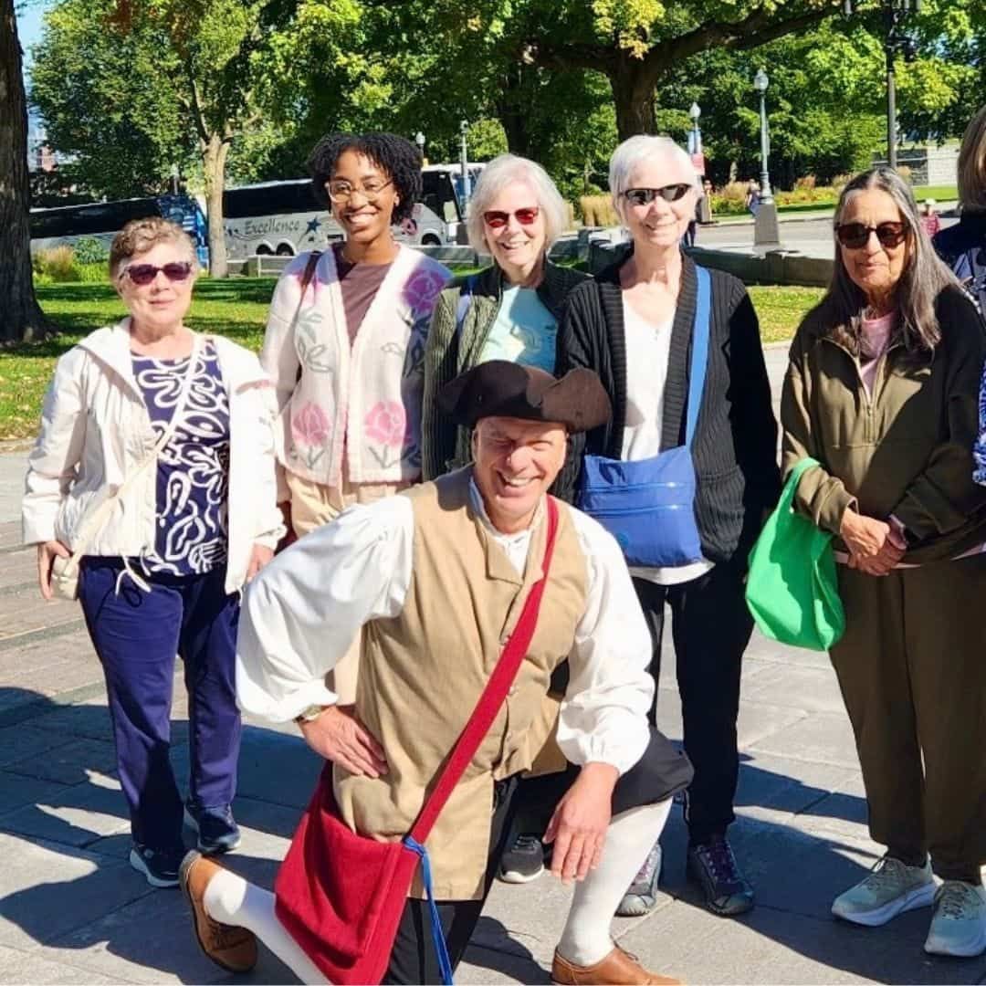 CosmoVista Tours travellers with a costumed local guide during a guided sightseeing tour of Québec City.
