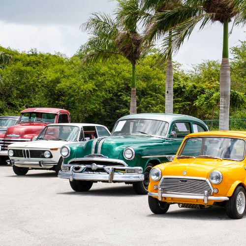 Row of classic cars parked | Larsen Automotive Inc