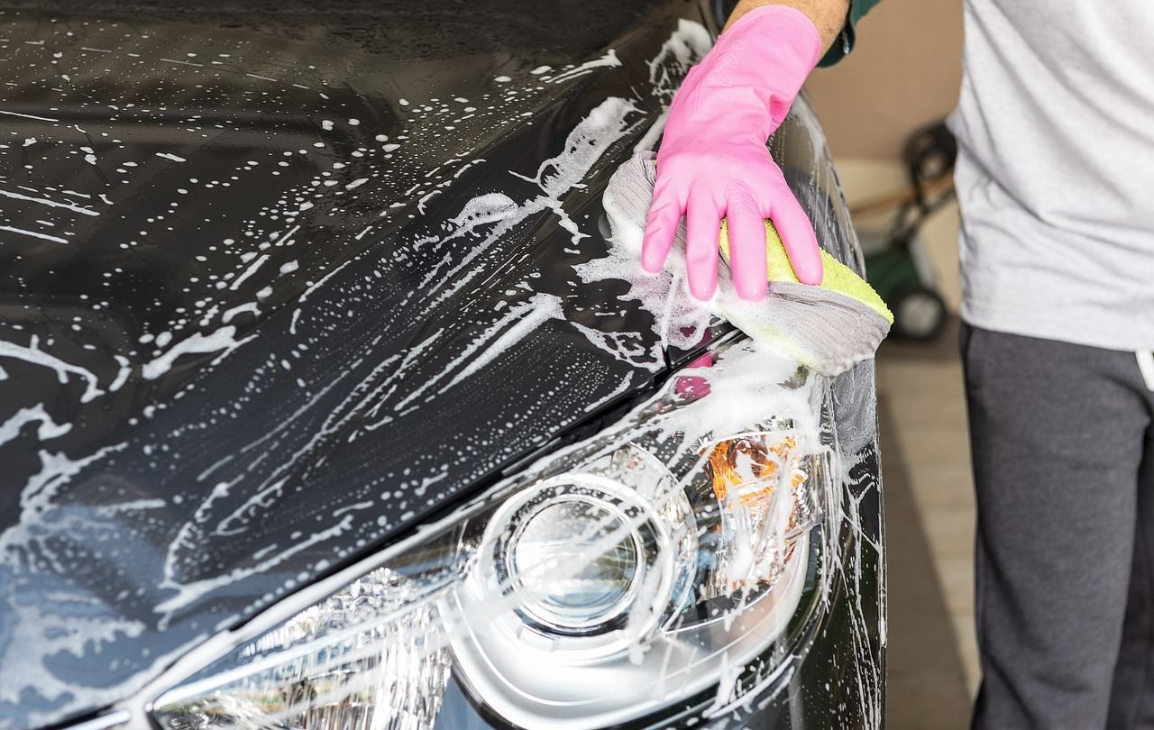 Cleaning front of car | Larsen Automotive Inc