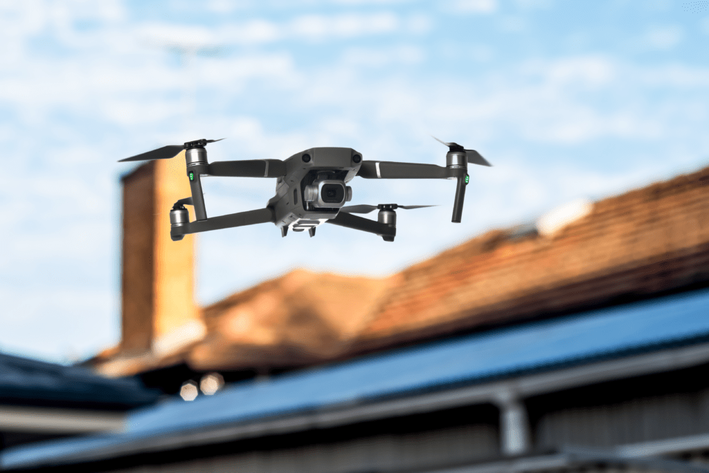 A drone is flying over a house roof
