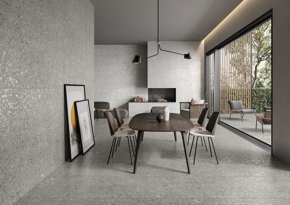 A Dining Room With a Table and Chairs and a Fireplace — Tileflair in Mitchell, ACT