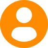 An orange circle with a white circle in the middle of it.