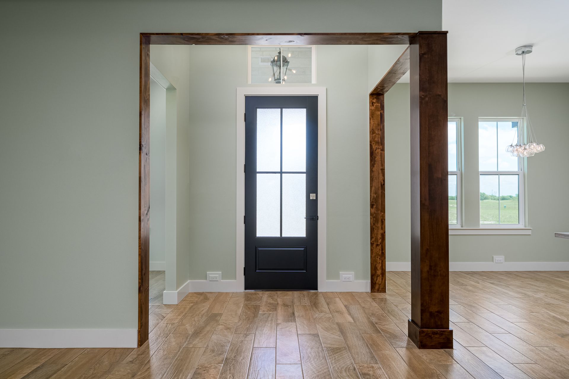 There is a black door in the middle of the room.