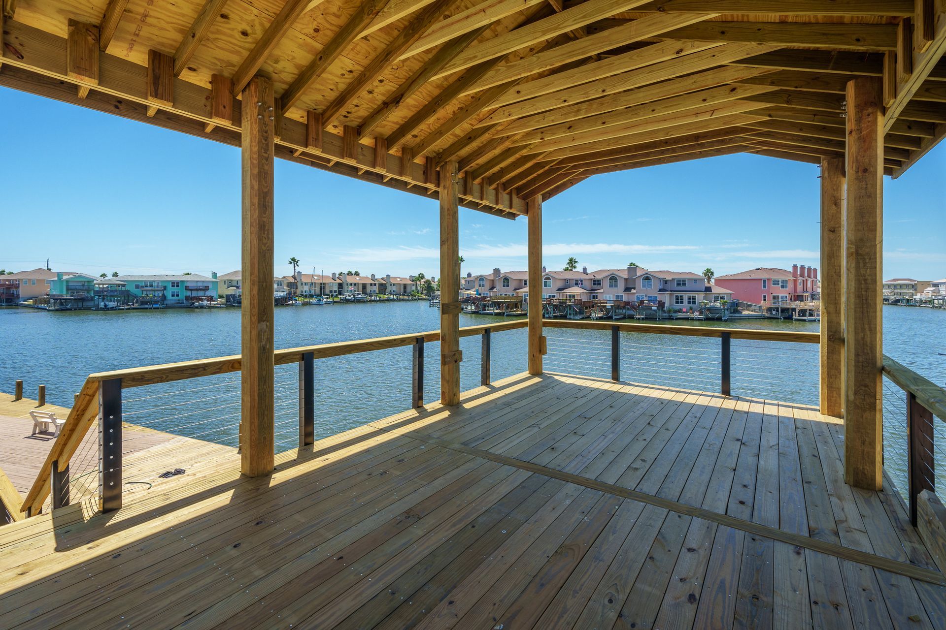 A wooden deck overlooking a body of water
