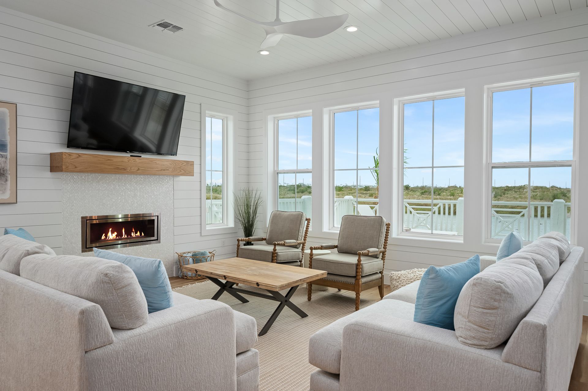 A living room filled with furniture and a flat screen tv