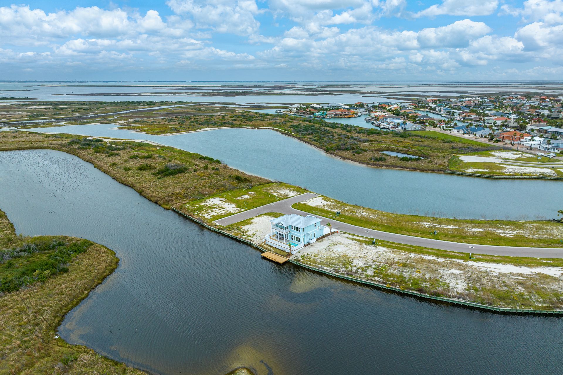 An aerial view of a small island in the middle of a body of water
