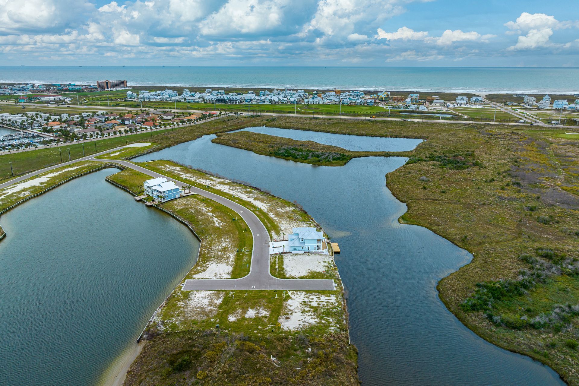 An aerial view of a small island in the middle of a body of water.