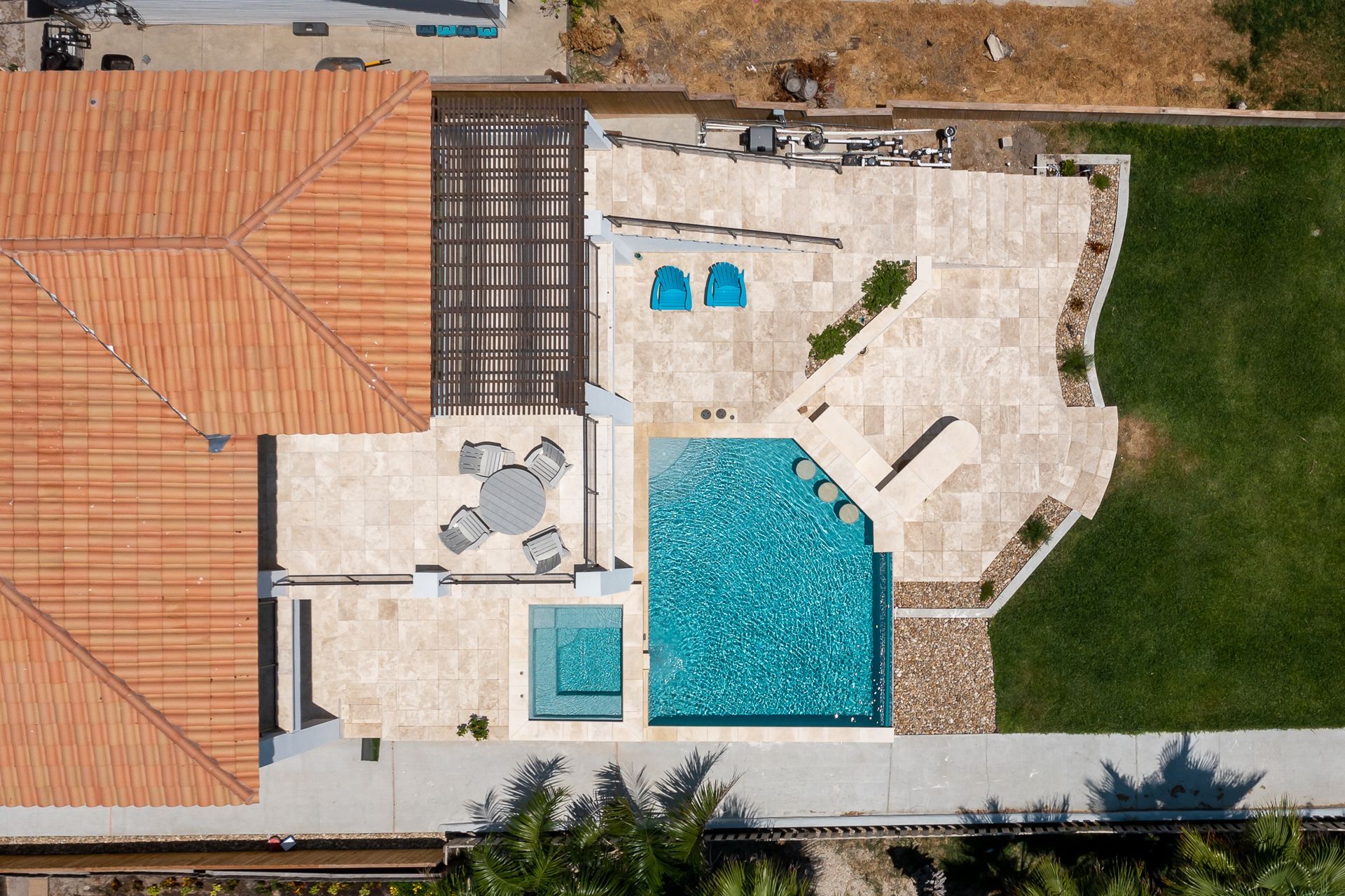 An aerial view of a house with a swimming pool