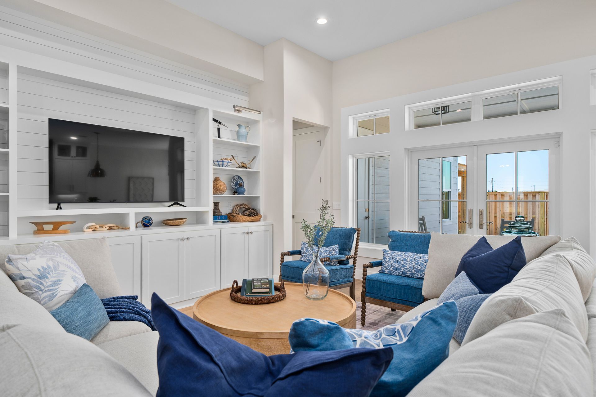A living room filled with furniture and a flat screen tv.