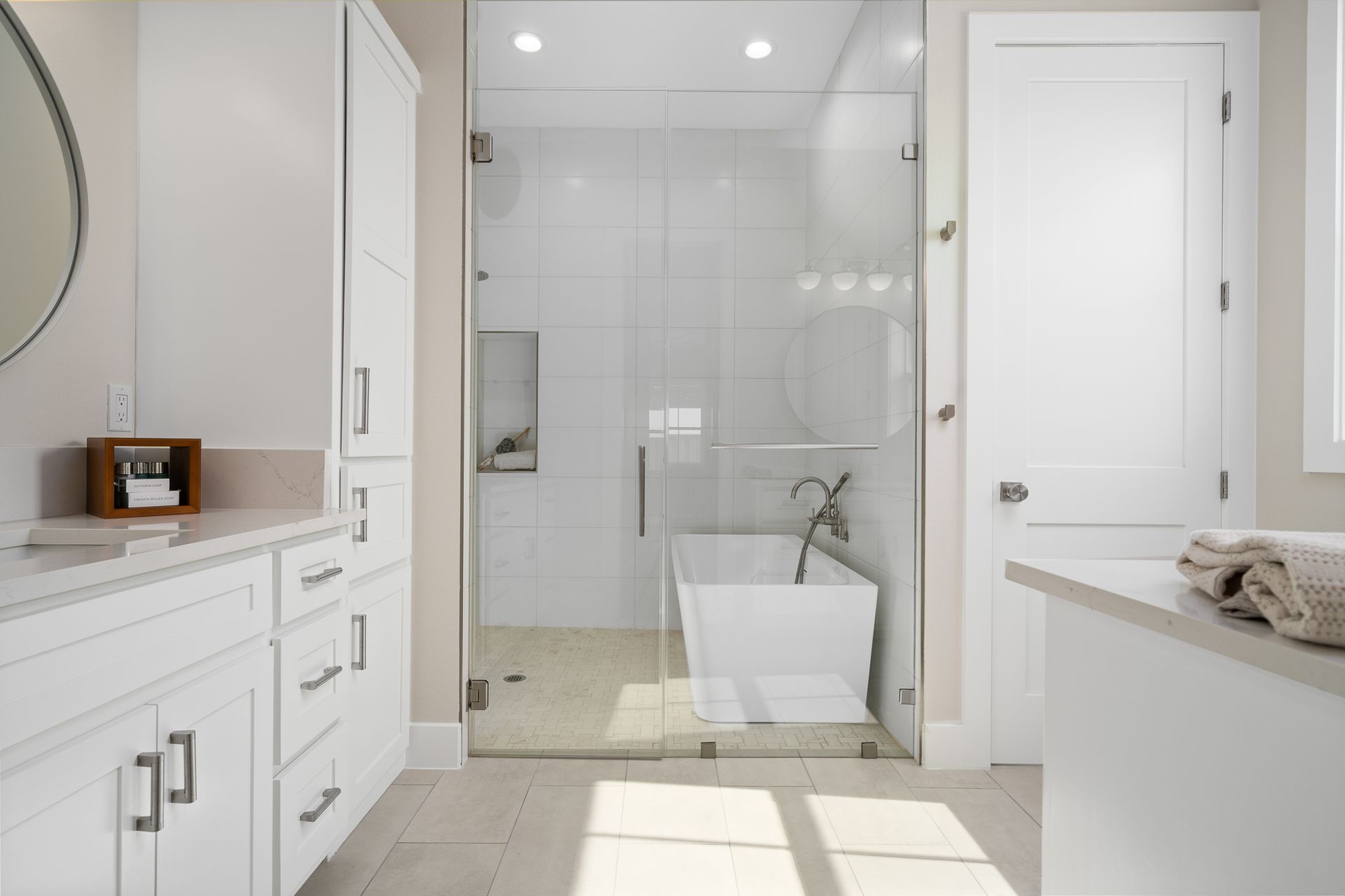 A bathroom with a bathtub and a walk in shower.