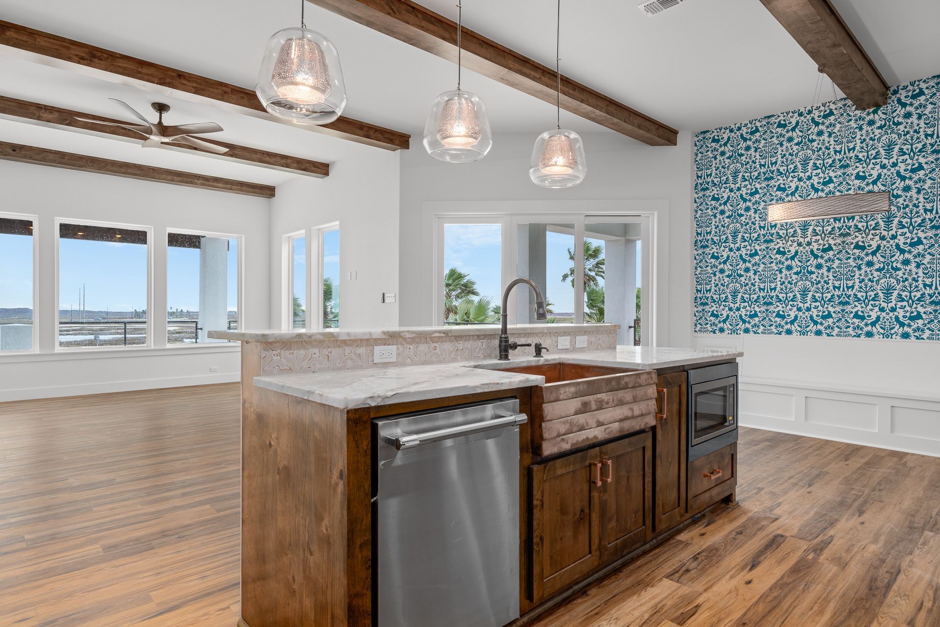 There is a large island in the middle of the kitchen.