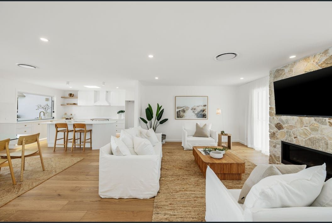 A Living Room Filled With Furniture and a Fireplace — Artizen Curtains in Mooloolaba, QLD