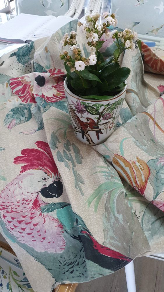 A Potted Plant is Sitting on Top of a Table Cloth With Birds on It — Artizen Curtains in Mooloolaba, QLD