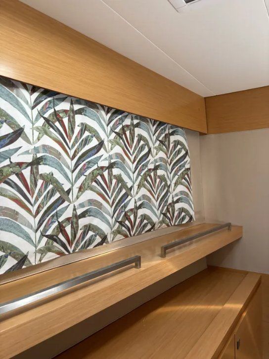 A Room With a Shelf and a Wall With a Pattern on It — Artizen Curtains in Mooloolaba, QLD