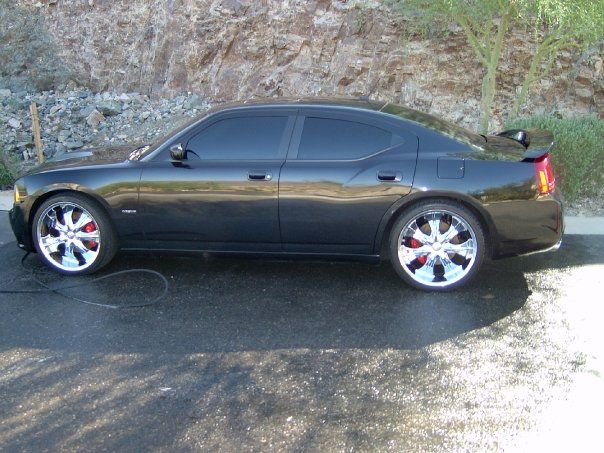 Black Dodge Charger with glossy finish after ceramic coating service in Gilbert AZ