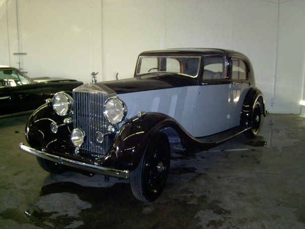 Classic Rolls-Royce with restored glossy paint after professional detailing