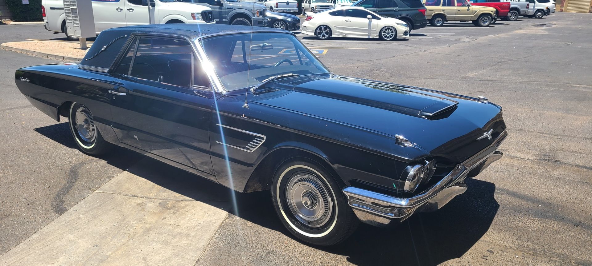 Classic Ford Thunderbird with restored glossy paint after professional detailing