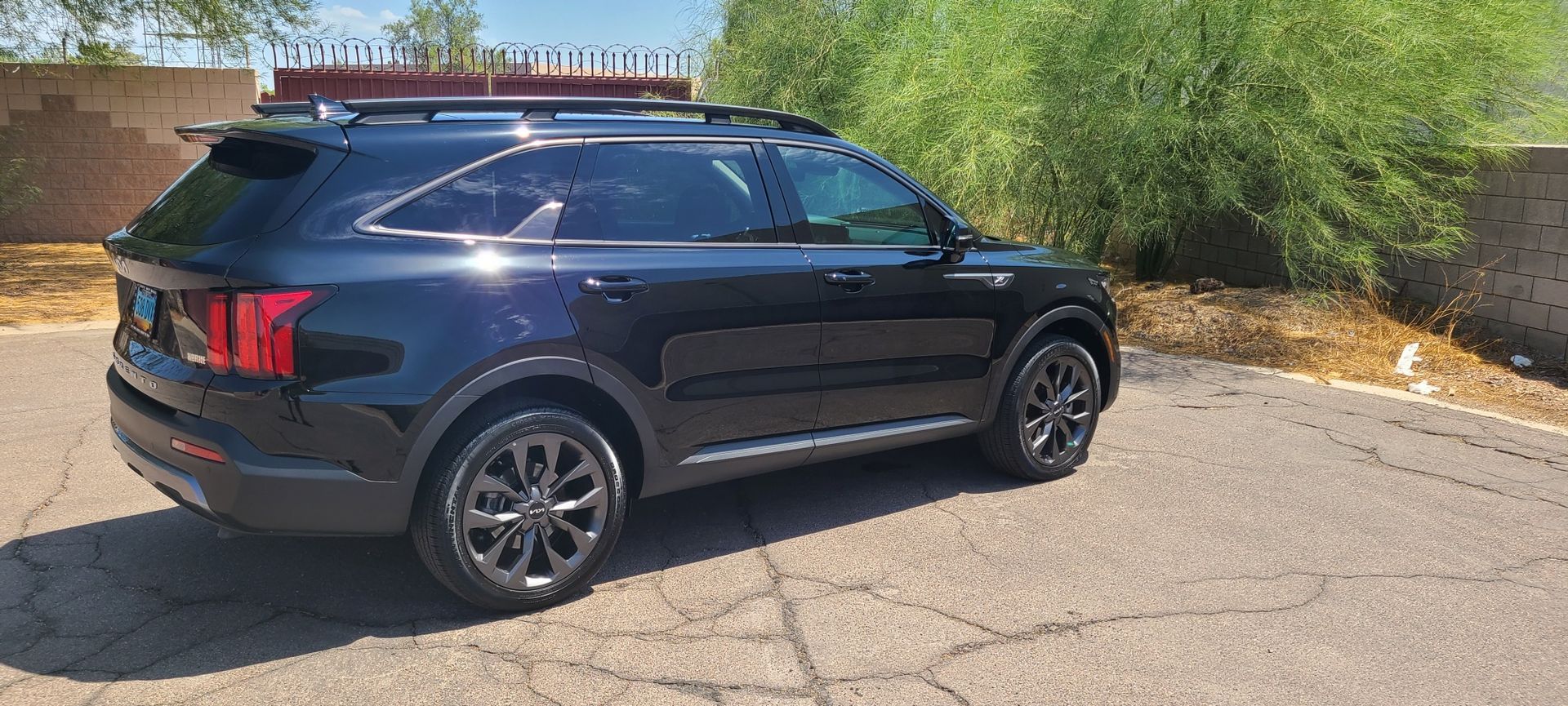Black Kia Sorento after ceramic coating service in Gilbert AZ