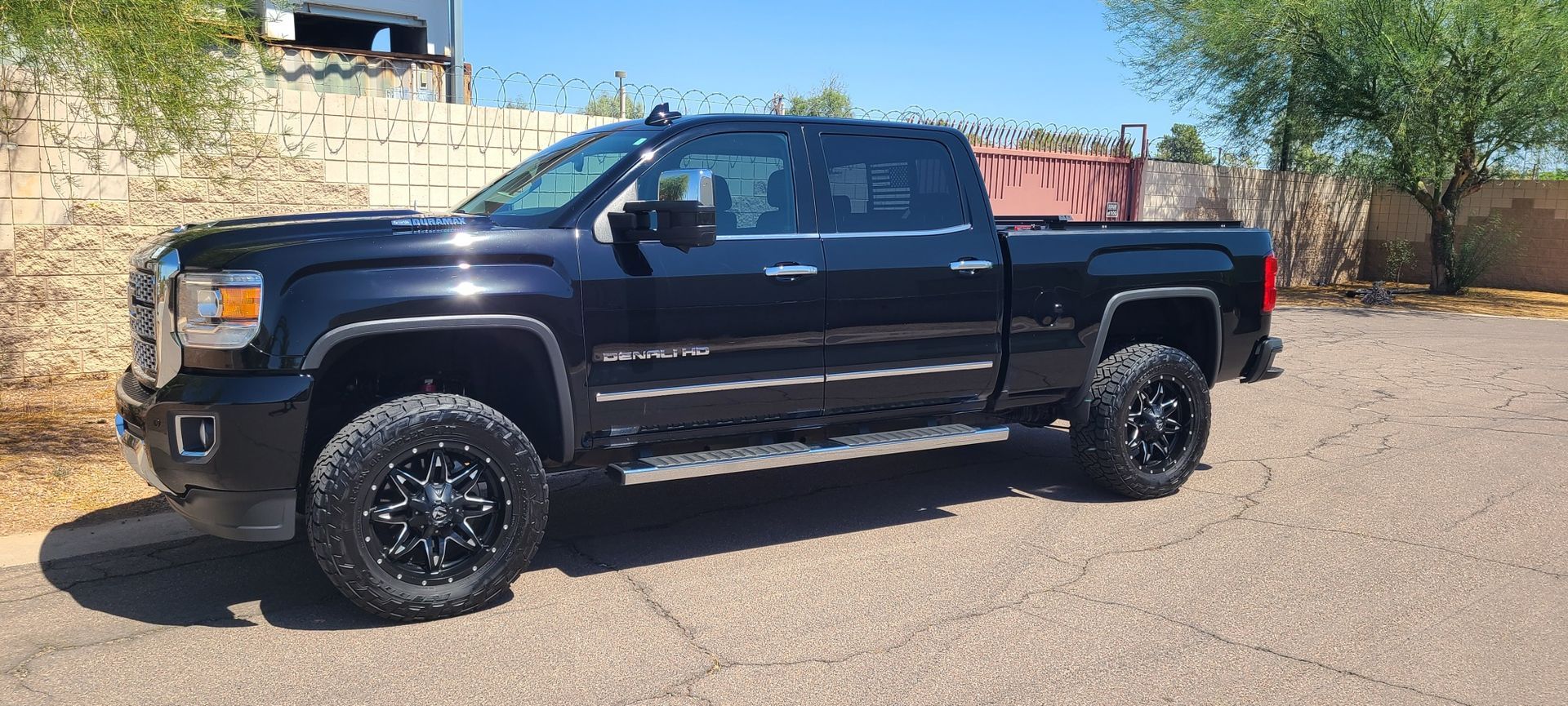 Black GMC Sierra Denali with glossy finish after ceramic coating service