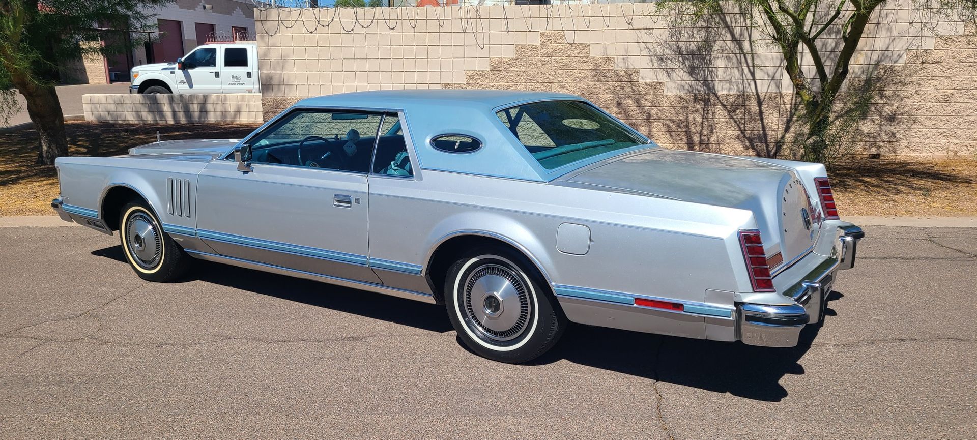 Classic Lincoln Continental with polished paint after professional detailing