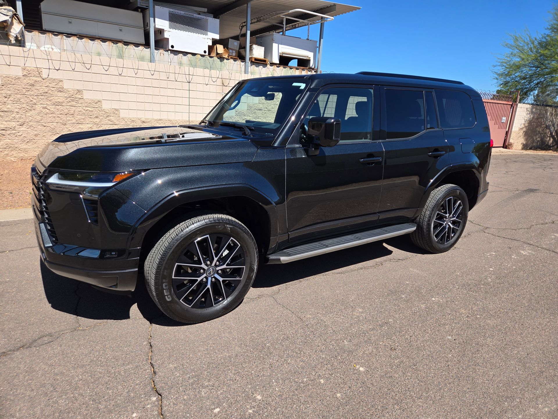 Black Lexus GX SUV with enhanced shine from ceramic coating in Gilbert AZ
