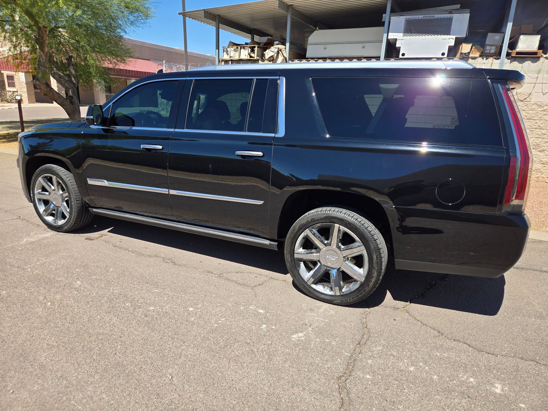 Black Cadillac Escalade with glossy paint after professional ceramic coating