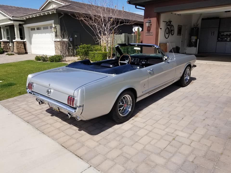 Rear view of white Ford Mustang convertible after professional detailing