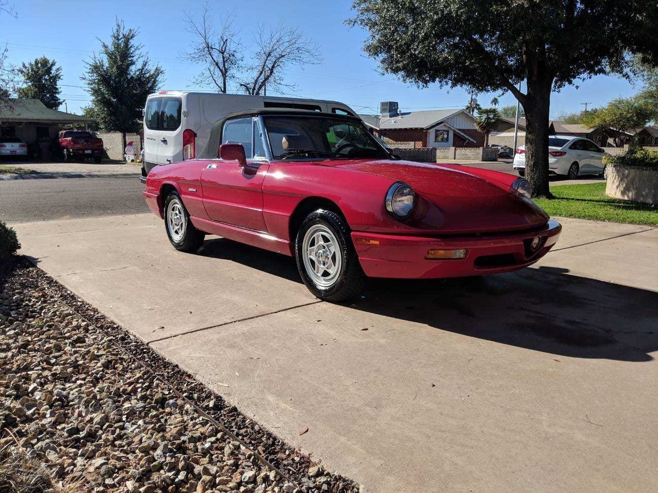 Red Alfa Romeo Spider with polished paint after ceramic coating service