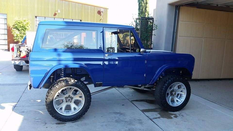 Classic Ford Bronco with restored blue paint after professional exterior detailing