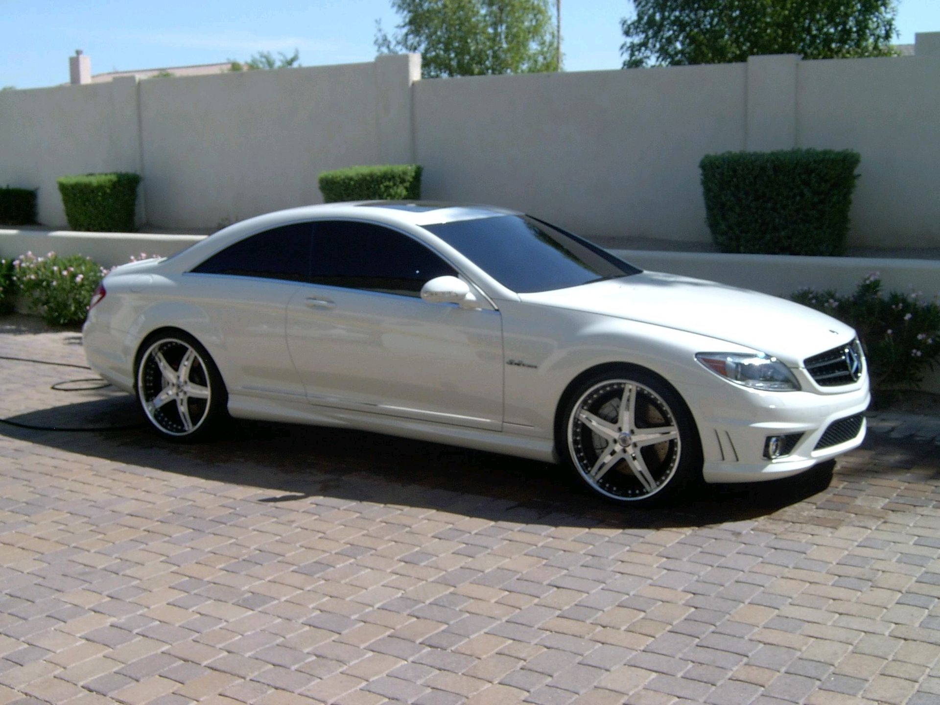 White Mercedes-Benz coupe with glossy finish after ceramic coating service