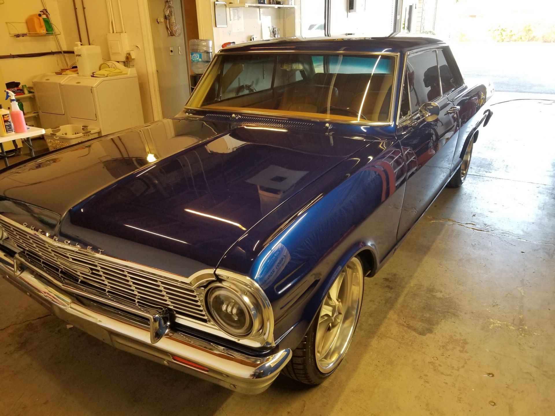 Classic vehicle with restored glossy paint after professional detailing