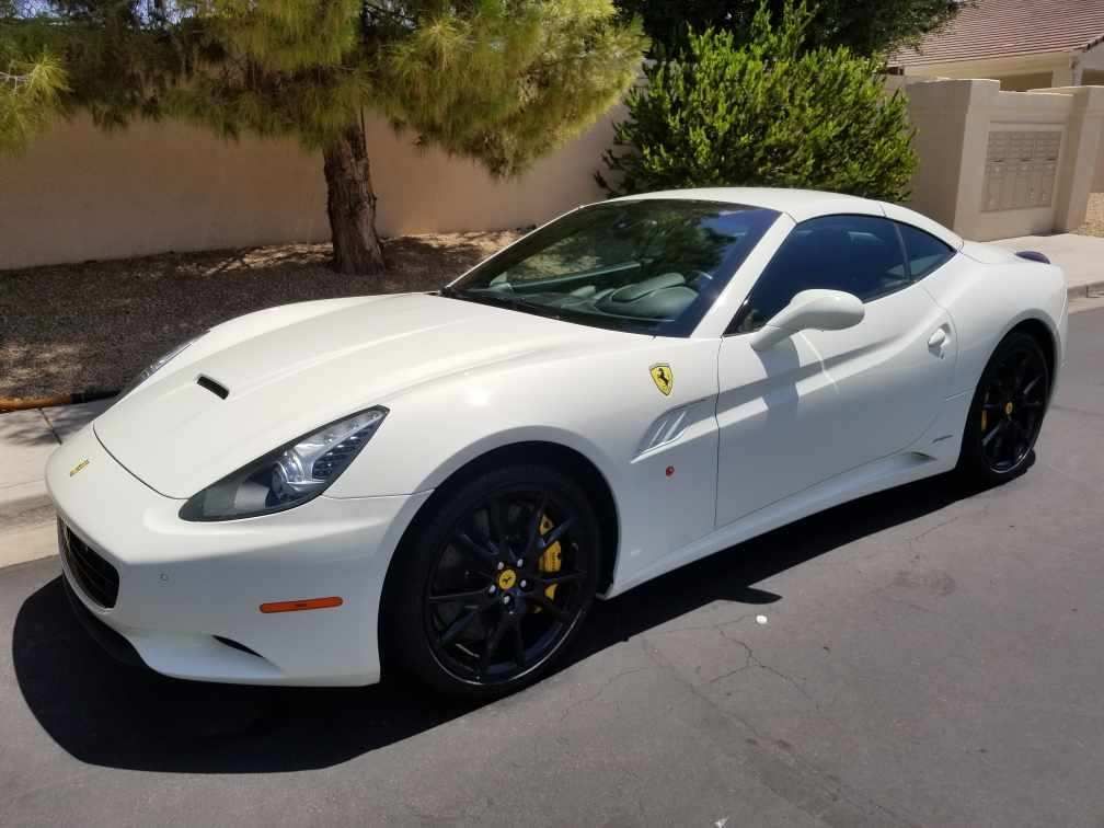 White Ferrari after ceramic coating service with enhanced paint gloss