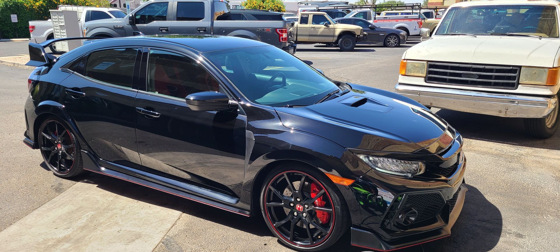 Glossy black vehicle after ceramic coating in Gilbert AZ
