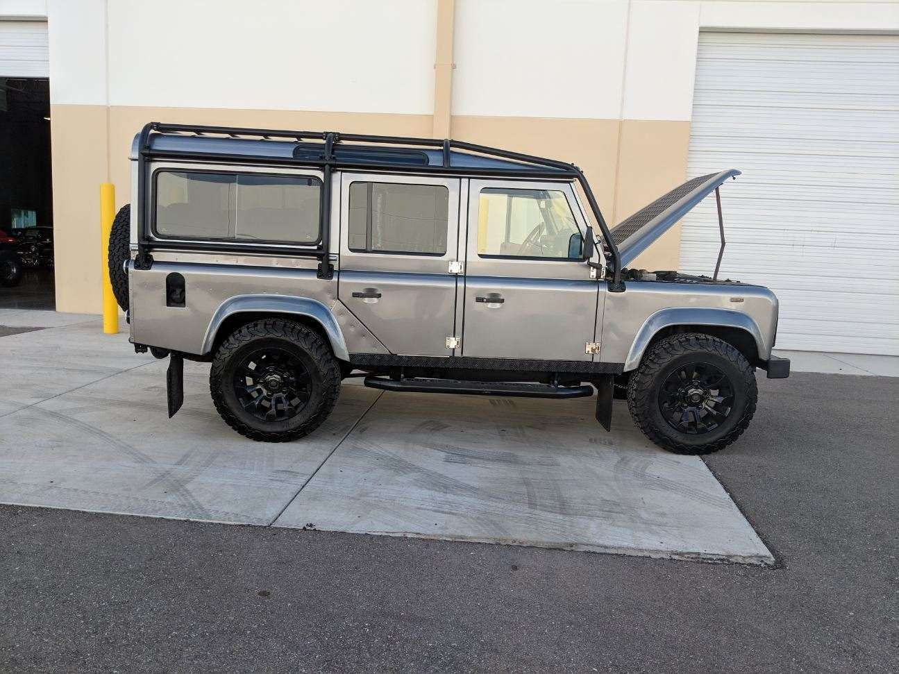 Gray Land Rover Defender after ceramic coating service with enhanced paint protection