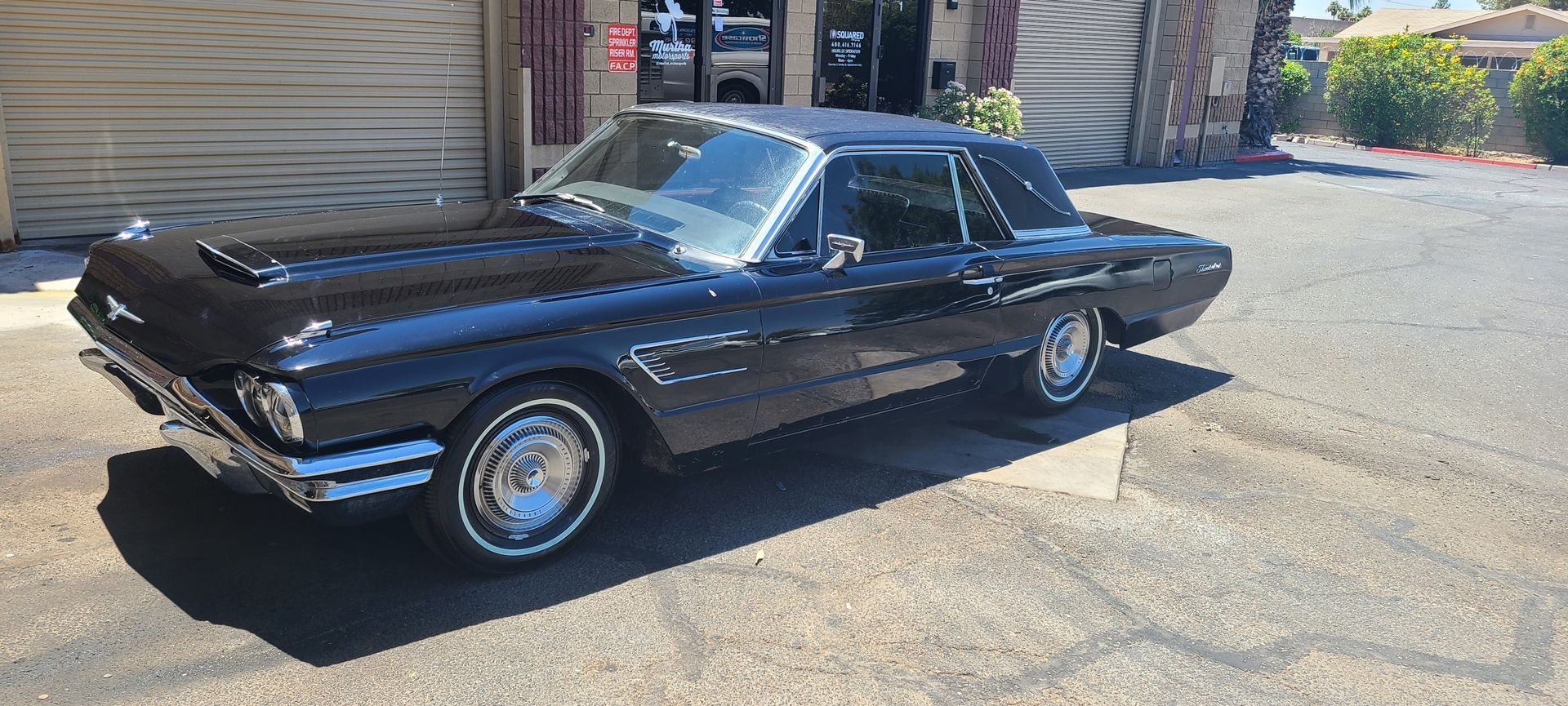 Classic Ford Thunderbird with restored glossy paint after professional detailing