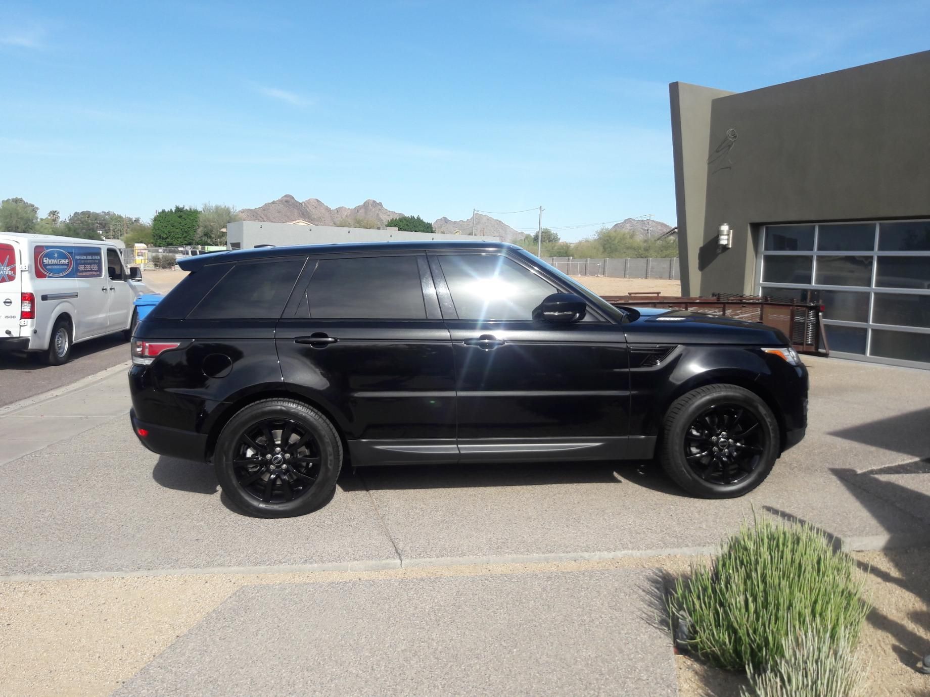 Glossy black vehicle after ceramic coating in Gilbert AZ