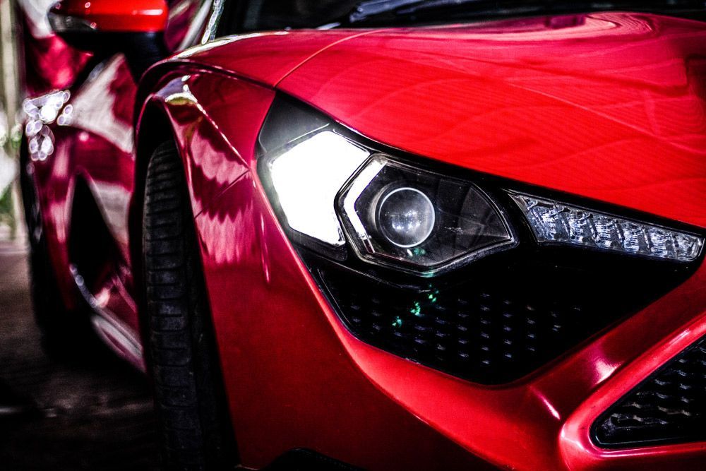 A Close Up Of A Red Sports Car 's Headlight — MJ's Mobile Car Mechanic In Wollongong, NSW