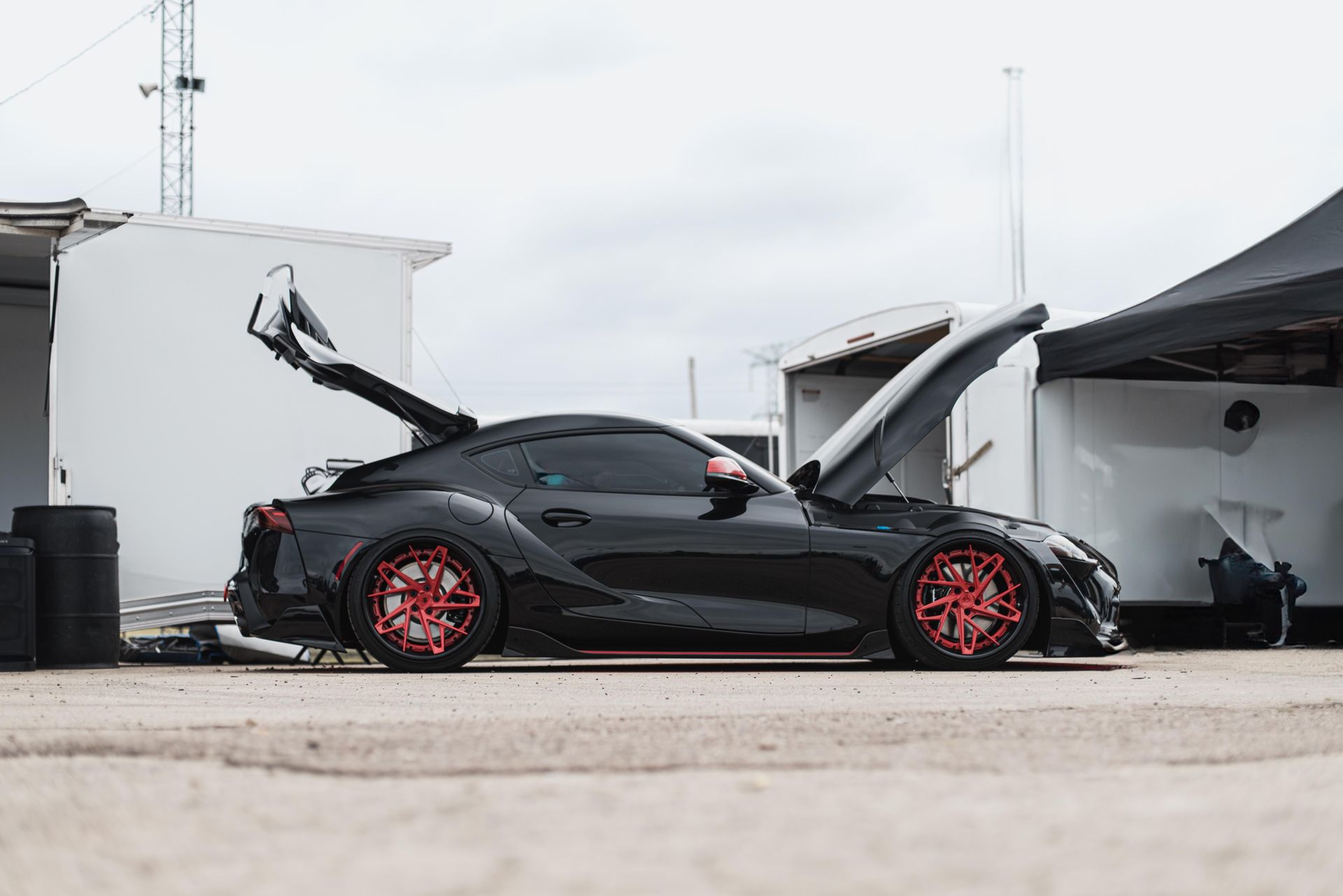 Black Toyota Supra With Red Rims — MJ's Mobile Car Mechanic In Albion Park, NSW