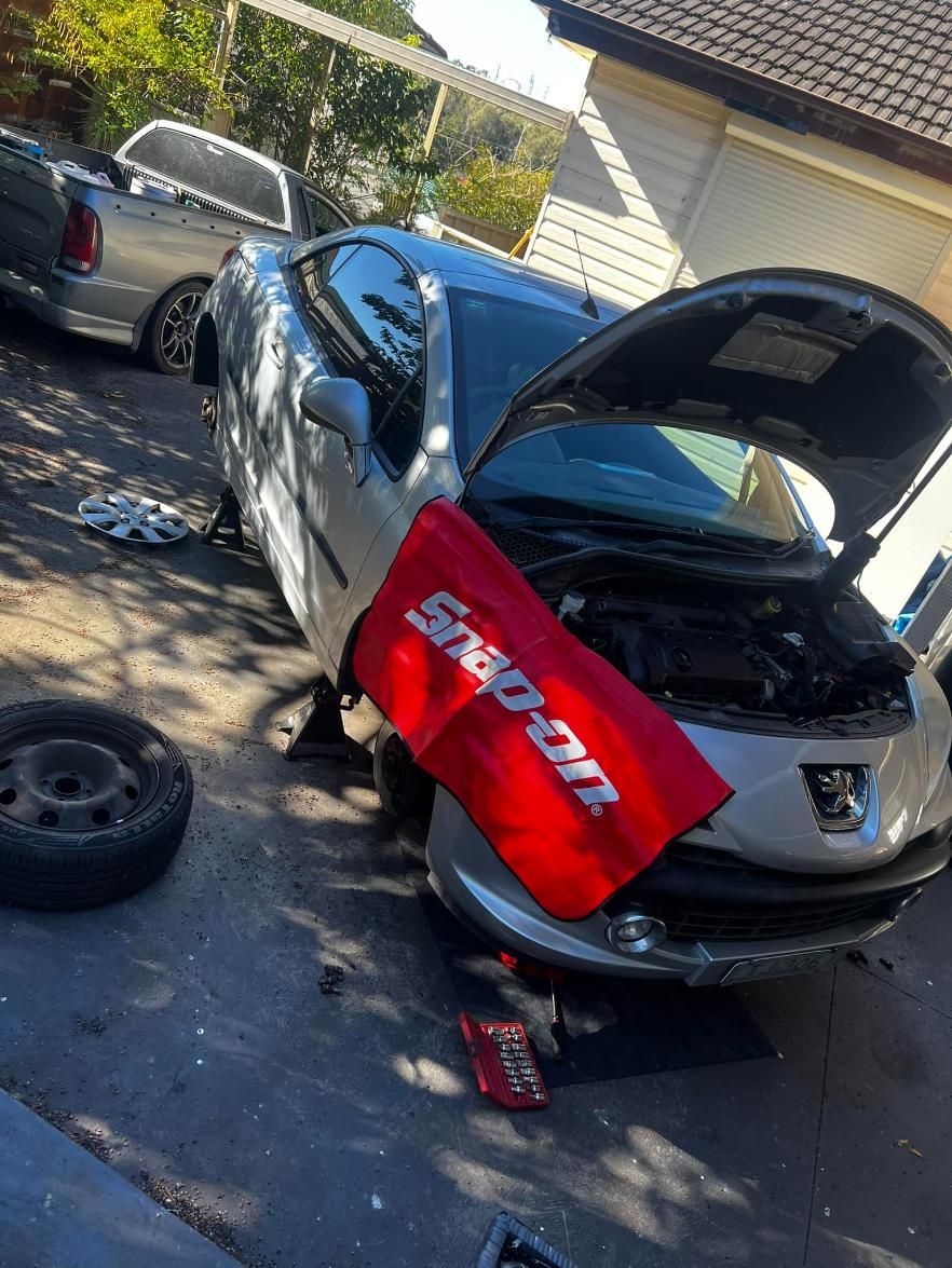 A Car With The Hood Up And A Red Snap On Towel On The Side — MJ's Mobile Car Mechanic In Mount Annan, NSW