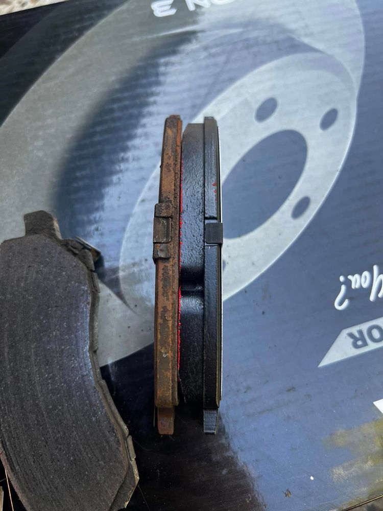 A Pair Of Brake Pads Are Sitting On Top Of A Box — MJ's Mobile Car Mechanic In Wollongong, NSW