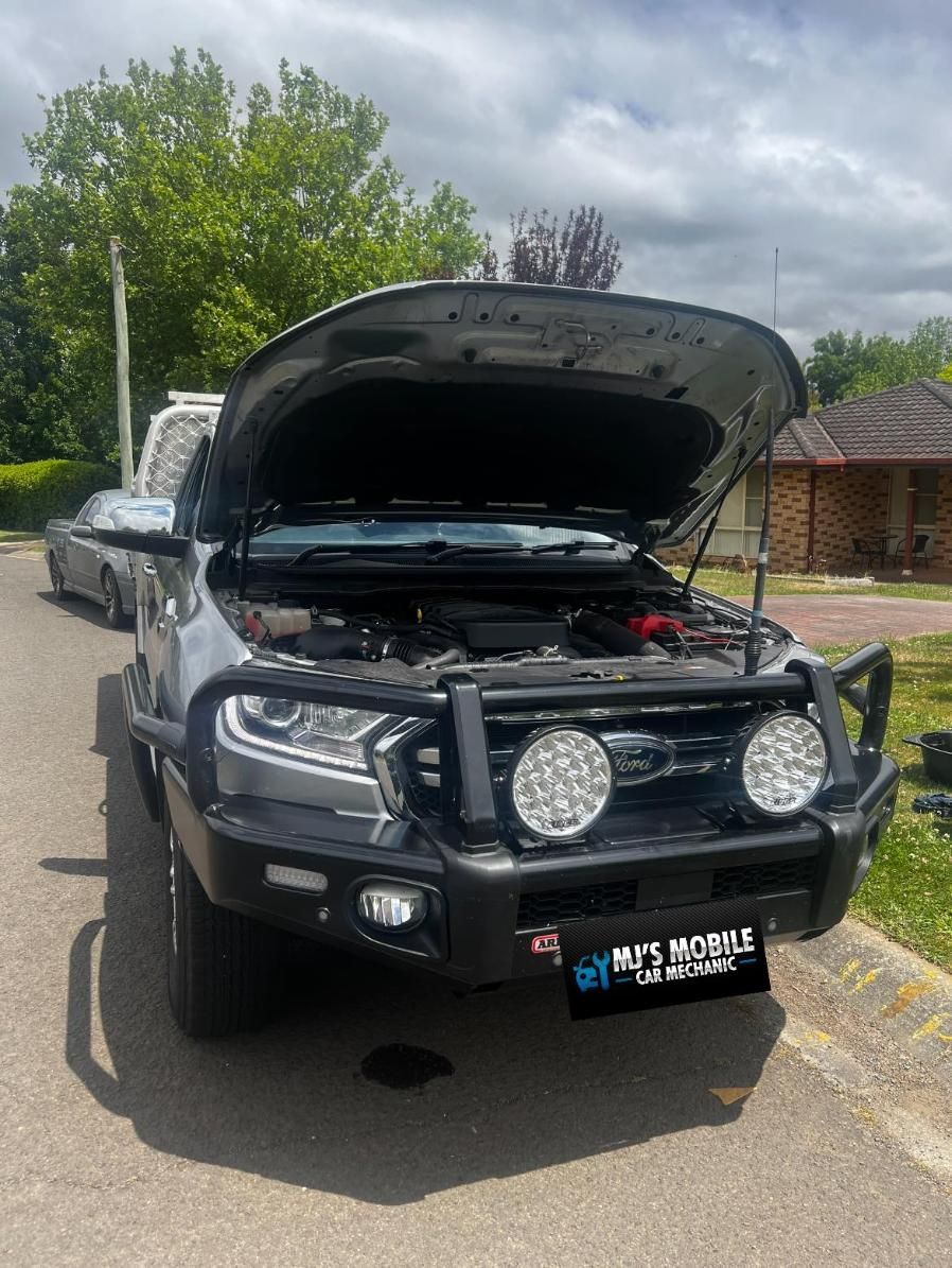 A Ford Ranger With Its Hood Up Is Parked On The Side Of The Road — MJ's Mobile Car Mechanic In Cordeaux Heights, NSW